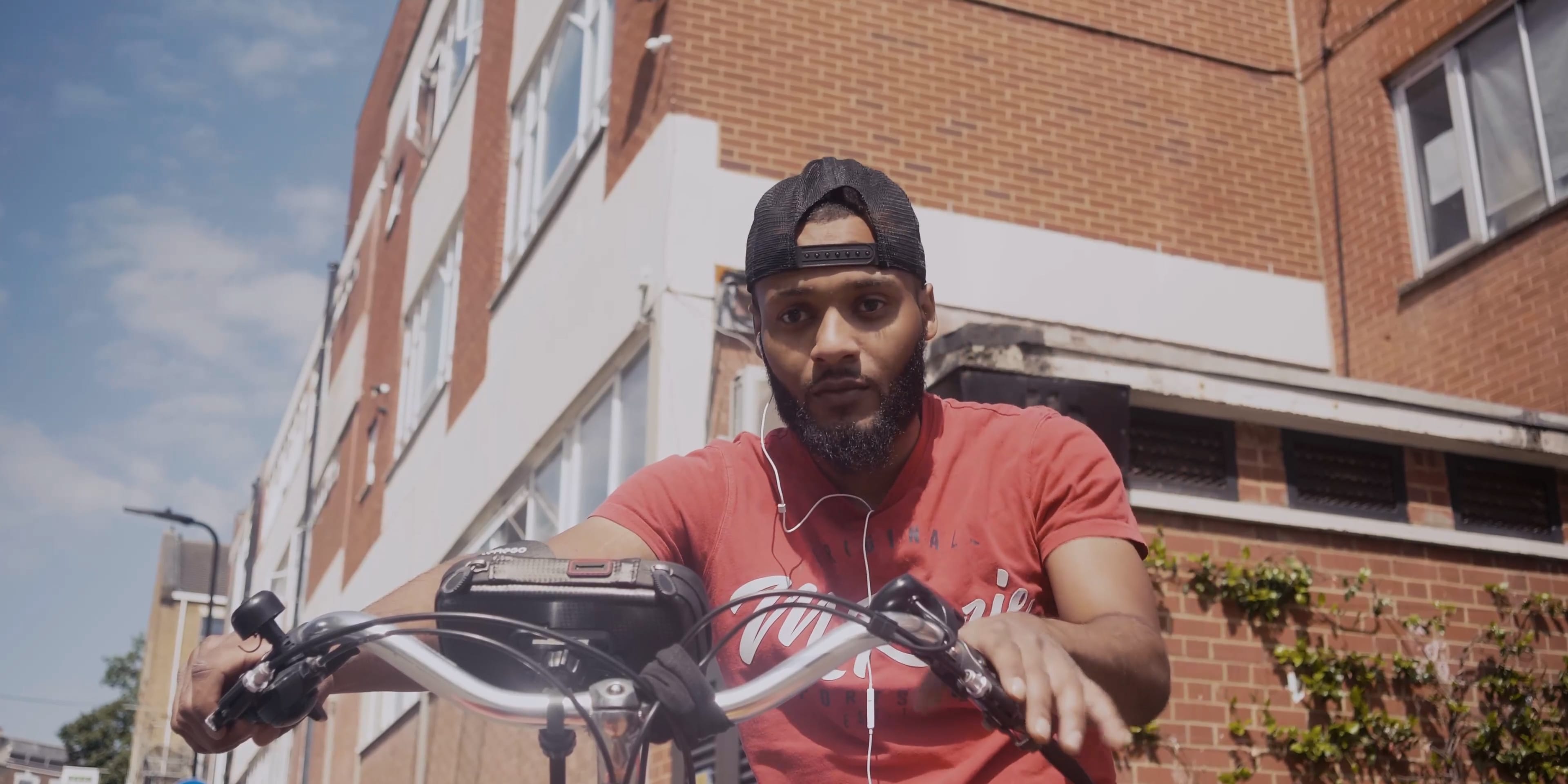 A man riding his bicycle in town