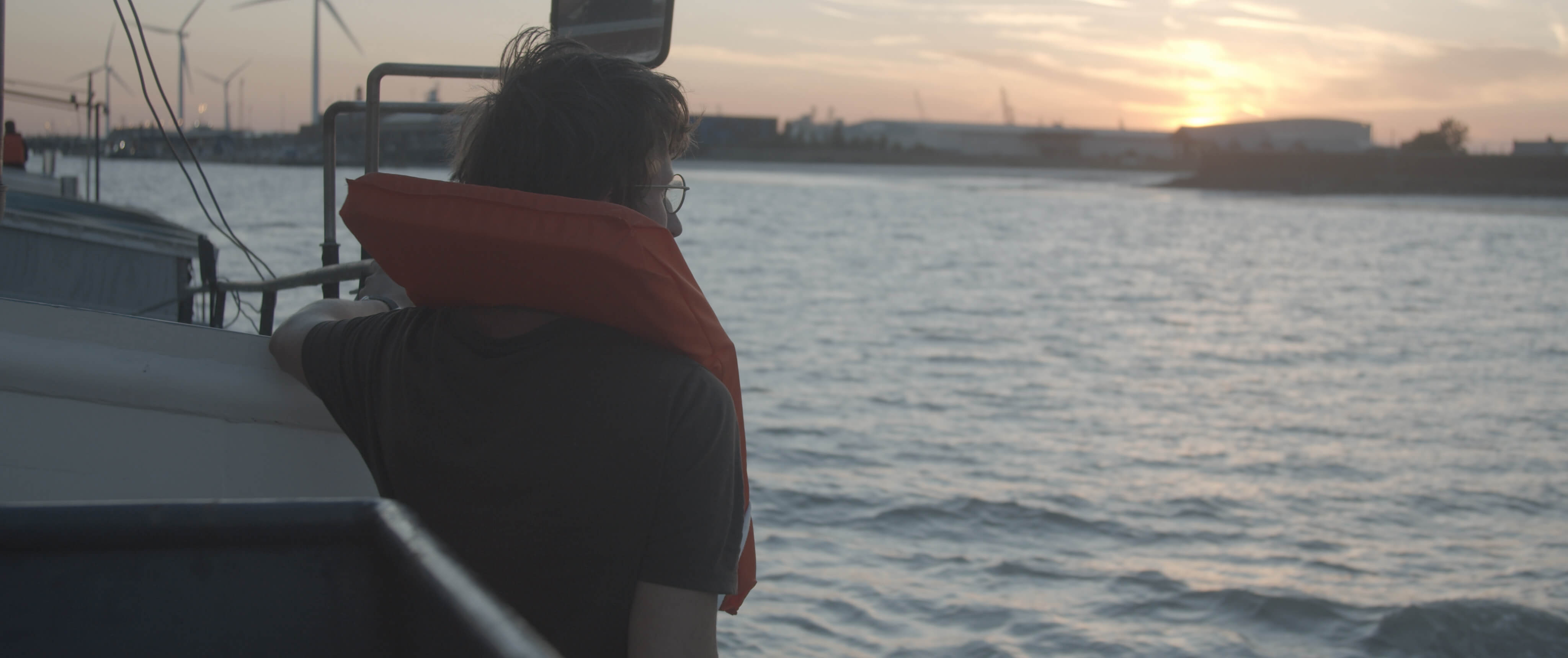 Theatreship, a man looking out to sea from a boat