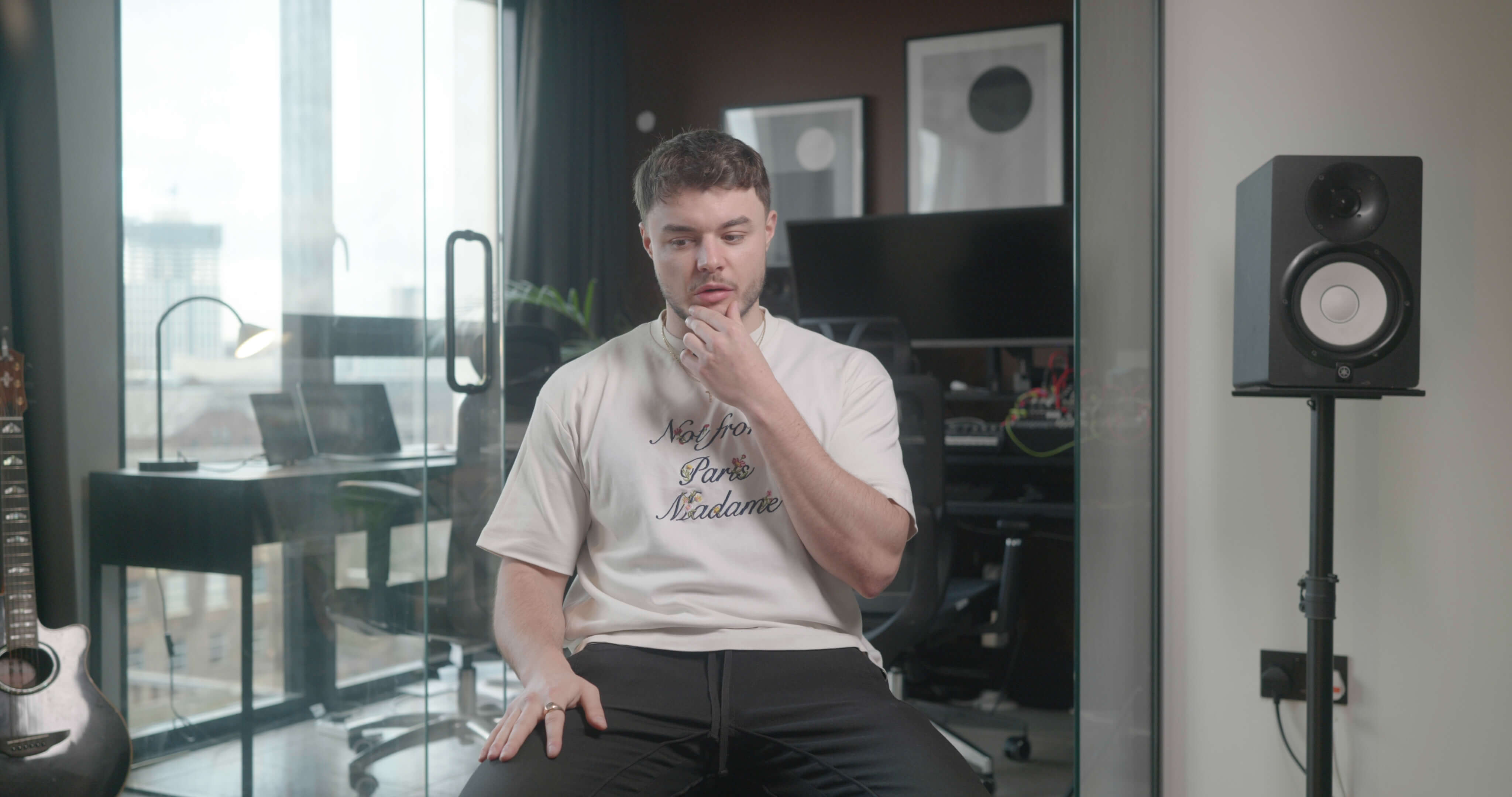 Man giving interview to camera in office space